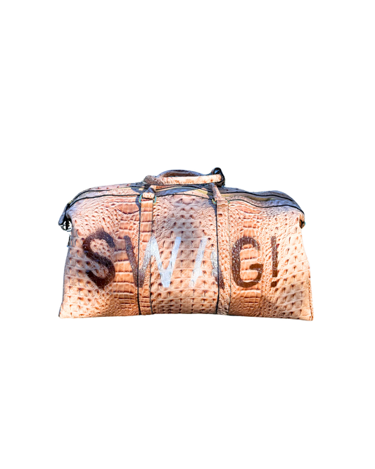 SWAG! Duffle in beige croc-embossed vegan leather with brown hand-stenciled SWAG! lettering, front view
